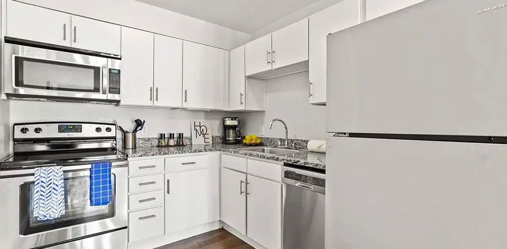 Kitchen — stainless appliances and stone counters